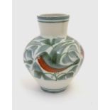 A Laurence McGowan British studio pottery vase with hand painted decoration of birds in foliage