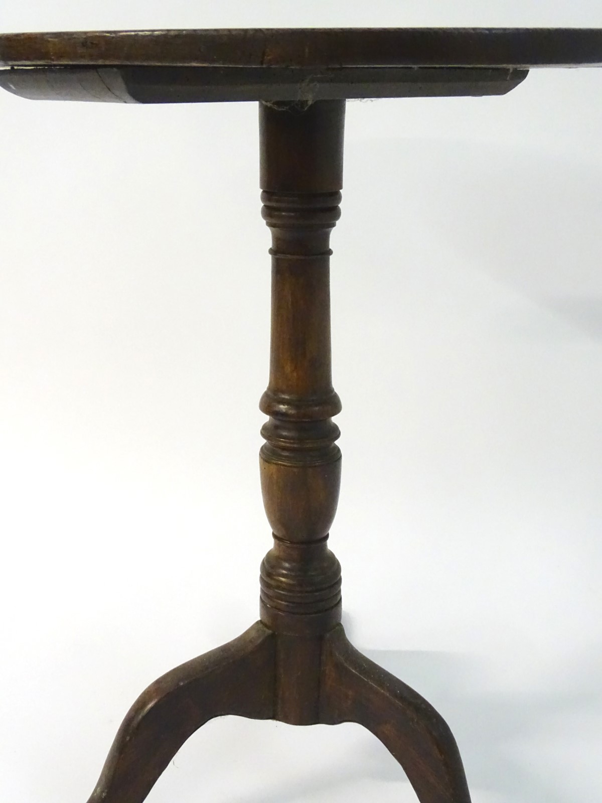A late 18thC oak tripod table with a circular table top above a turned stem and standing on three - Image 4 of 7