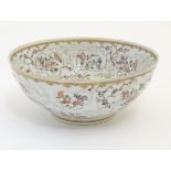 An 18thC Chinese bowl with panelled floral decoration. Approx. 3 3/4" high x 9" diameter.