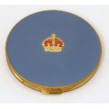 A vintage Stratton powder compact with crown emblem to top.