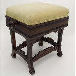 An early 20thC rosewood rise and fall piano stool,