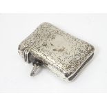 A silver vesta case with engraved decoration Hallmarked Birmingham 1898 maker E V Pledge & Son.