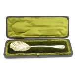 An Edwardian silver serving spoon,