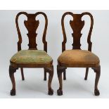 A pair of early 18thC Queen Anne walnut chairs with curved top rails above shaped backsplats and