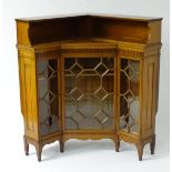 A late 19thC walnut Arts & Crafts corner bookcase cabinet attributed to George Jack for Morris & Co.