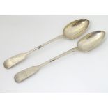 A Victorian pair of silver fiddle pattern serving spoons hallmarked London 1841 maker Robert