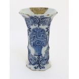 An 18thC Delft blue and white octagonal vase with a flared rim,