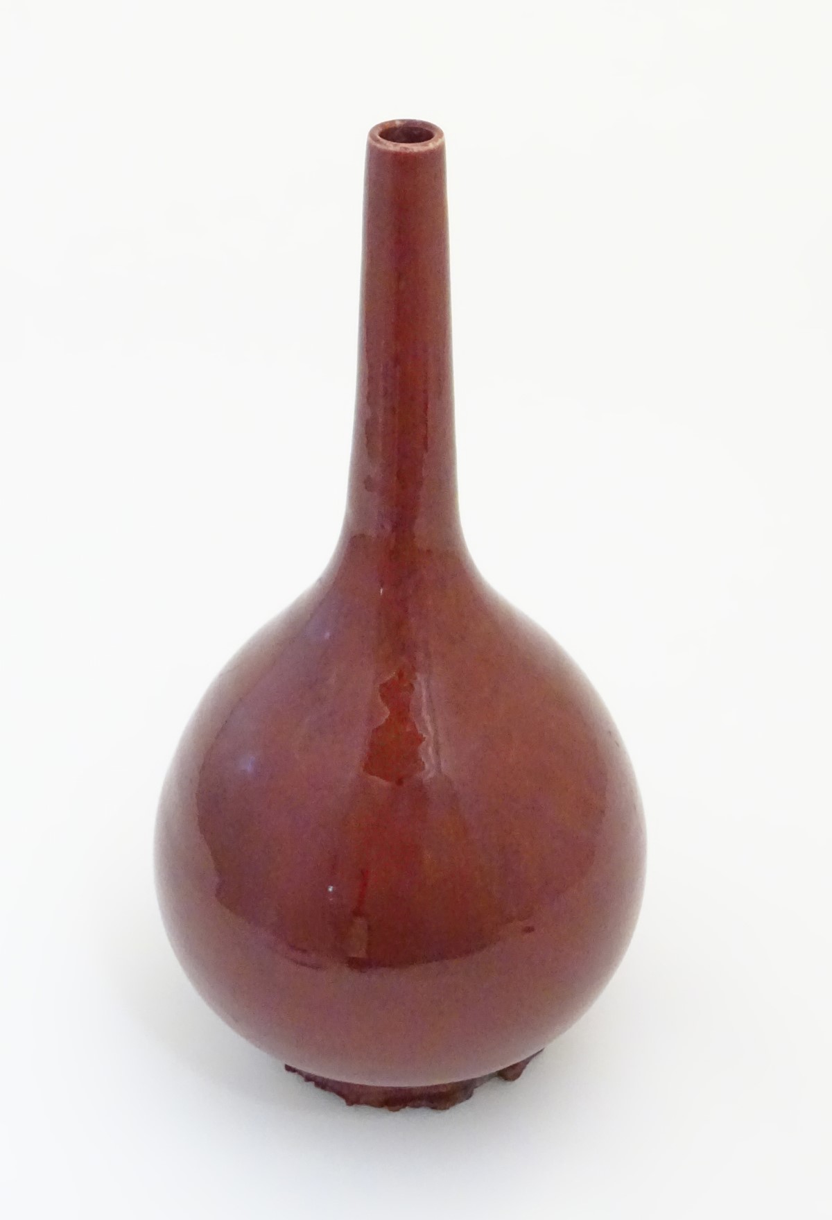 A Chinese pear-shaped vase with a slender, elongated neck with a sang de boeuf glaze. Approx. - Image 4 of 5