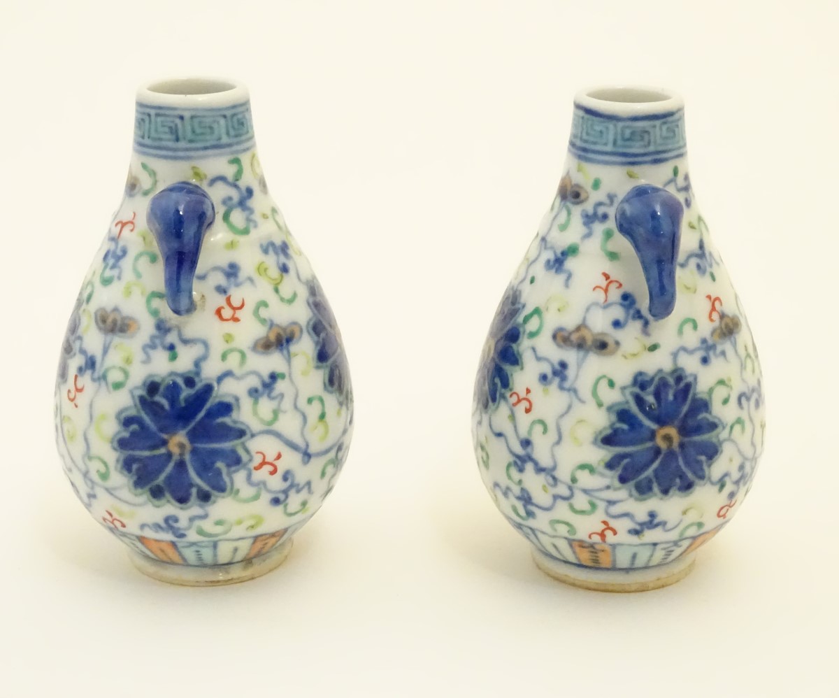 A pair of Chinese miniature doucai baluster vases, decorated with flowers, - Image 4 of 6