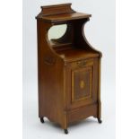 An early 20thC Sheraton revival mahogany purdonium with a shaped up stand above two satinwood