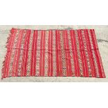 Carpet / Rug : A hand made flat weave wall hanging having 11 bands of woven crossed decoration,