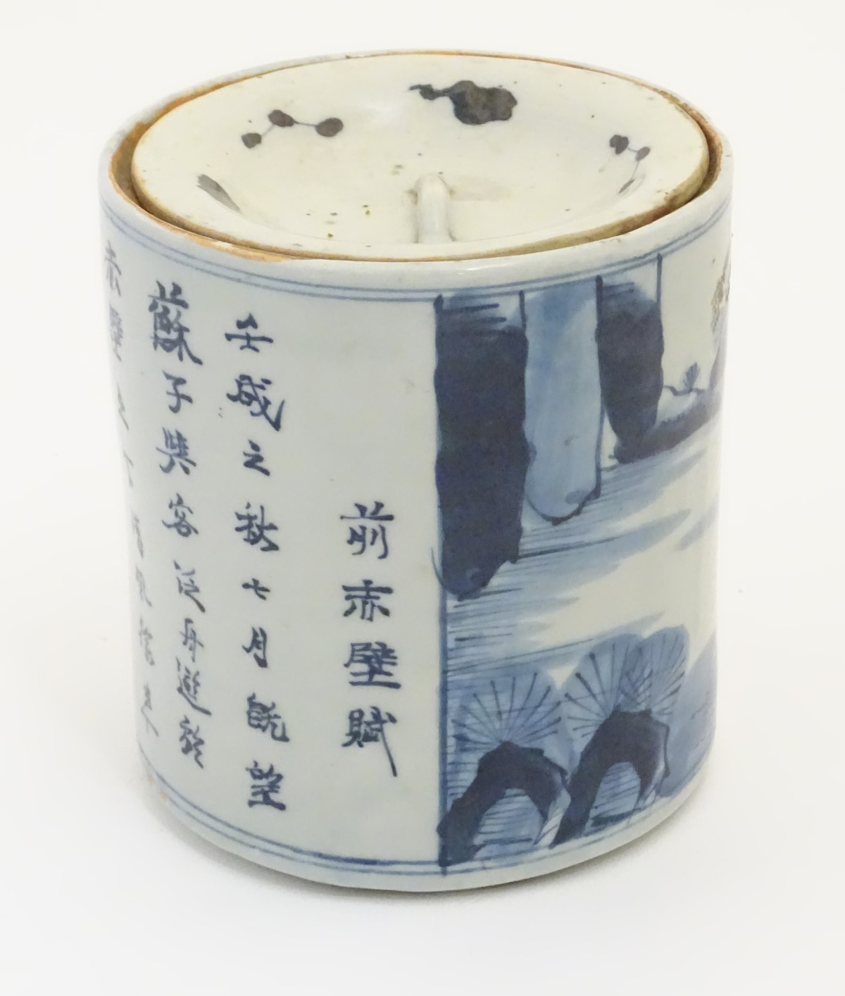 A 19thC Chinese blue and white lidded pot / biscuit barrel decorated with Chinese script and a