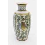 A Laurence McGowan British studio pottery vase decorated with blue bellied birds and foliage.