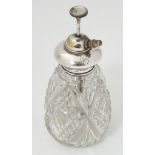 A cut glass scent / perfume bottle with Sterling silver mount and atomiser top.