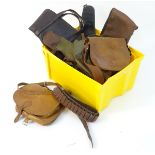 A box of assorted leather and canvas gunslips, cartridge belts and bags.