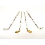 Novelty manicure tools, the handles formed as assorted gold clubs, many marked Sterling.