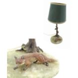 Fox Hunting: an onyx based and cold painted bronze table lamp (circa 1930) depicting a fox beside a