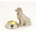 A novelty silver plate table salt formed as a dog before a bowl.