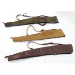 A box containing three assorted vintage leather and canvas gunslips,