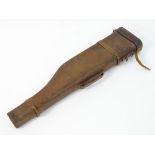 An early-20thC brown leather 'Leg-o'-mutton' breakdown gun case, with provision for 29" barrels.