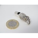 A novelty whistle with pheasant head decoration. Marked Sterling.