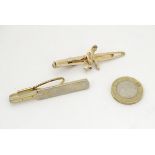 Two novelty tie pins, one with cricket bat decoration by Stratton,