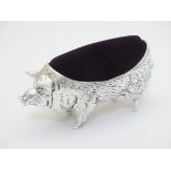 A large silver plate pin cushion formed as a pig 4 1/2" long CONDITION: Please Note