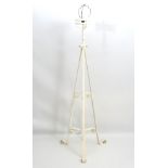 Arts and Crafts : a white painted late 19thC tripod formerly telescopic floor standing oil lamp