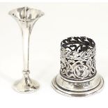 A silver dressing table bottle stand with Art Nouveau open work floral decoration.