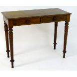 A late 19thC mahogany side table with a rectangular moulded top above two short frieze drawers and