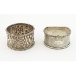A silver napkin ring with embossed decoration hallmarked London 1898 maker William Hutton & Sons