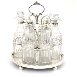 A Geo III silver cruet stand hallmarked London 1806 with 5 cut glass cruet bottle. The whole approx.