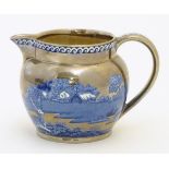 A Wedgwood of Etruria & Barlaston blue and white lustre cream jug in the pattern 'Fallow Deer',