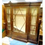 A mid 20thC mahogany break front bookcase / bibliotheque with three glazed sections containing
