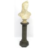 A 19thC fluted granite column and base surmounted by a white marble bust of a veiled woman with