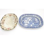 Two assorted oval serving plates, a stone china serving dish in willow pattern,