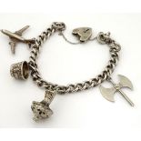 A silver charm bracelet set with silver and silver plate charms CONDITION: Please