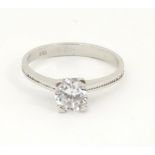 A 14kt white gold ring set with white stone CONDITION: Please Note - we do not make