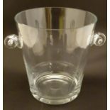 Champagne ice bucket: a glass tall clear two handled ice bucket, 9 1/4” high x 10 1/2” widest.