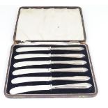 A set of 6 silver handled butter knives. Hallmarked Sheffield 1931 maker C H Beatson.