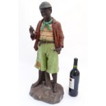 A Goldscheider style model of a young black male child holding a bird in his hand,