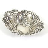 A small silver bon bon dish with embossed decoration.