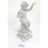 A 19thC German bisque figure of a seated Putti on a Rococo base and holding a palm in right hand,