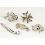 Assorted brooches including one formed as a seahorse,