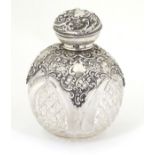 A cut glass scent / perfume bottle with silver detail hallmarked Birmingham 1910 maker Henry