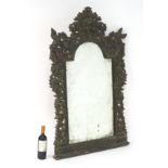 A late 19thC mirror with a carved painted frame and bevelled edged mirror. 33 ½” wide x 50 ½” wide.