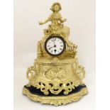 French gilt painted spelter mantel clock: a circular 30 hour timepiece movement in a case having an