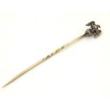 An interesting 19thC stick pin surmounted by an eagle and numbered '87', possibly military related,