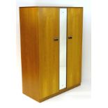 Vintage Retro: a British Limelight mid century 2 door wardrobe with mirror to central section,