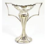 An Art Nouveau silver plate twin handled bud vase.